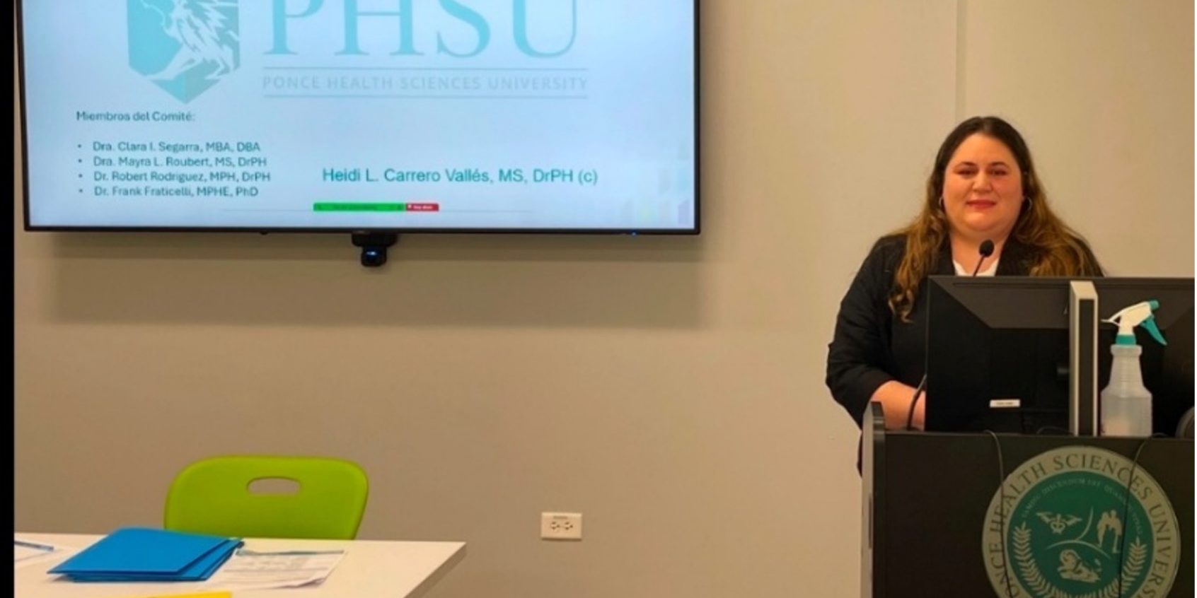 Heidi Carrero Dra. Heidi Carrero Vallés, a graduate student from the Public Health Program at Ponce Health Sciences University addresses the public from a podium