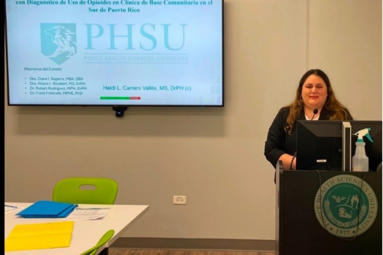Heidi Carrero Dra. Heidi Carrero Vallés, a graduate student from the Public Health Program at Ponce Health Sciences University addresses the public from a podium